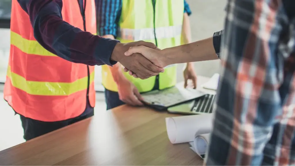 Houston digitla marketing agency shaking hands with industrial company