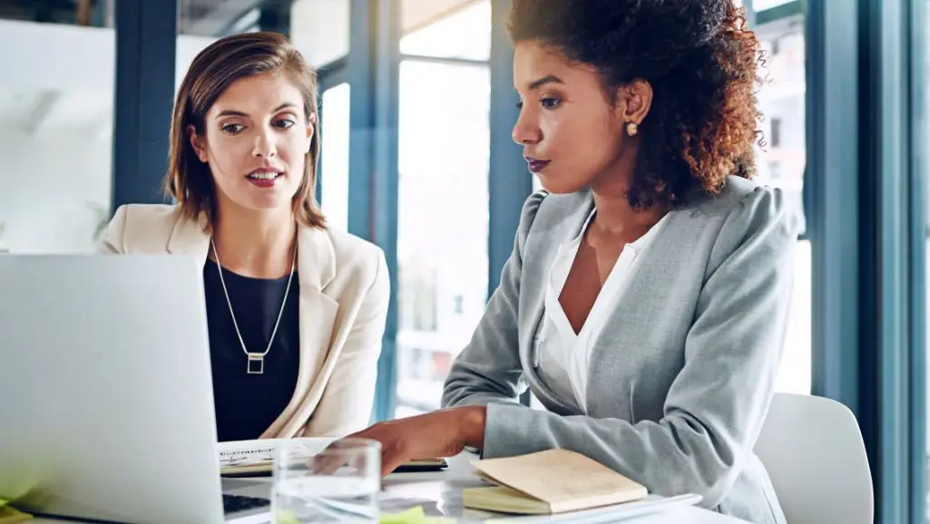 women assessing Houston social media optimization strategy