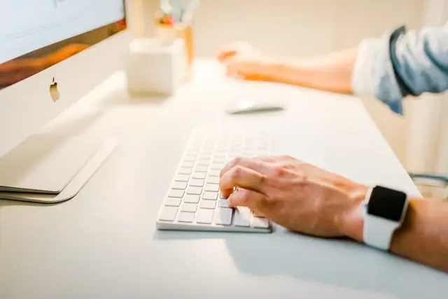 Person at computer creating content for Houston SEO