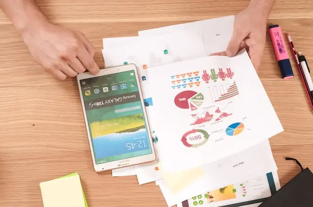 Person at digital marketing agency looking at digital marketing KPI charts.