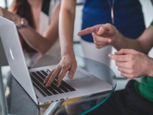 People at our Houston internet marketing agency looking at computer for our free website and marketing analysis