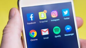 phone with many social media apps for Houston social media marketing